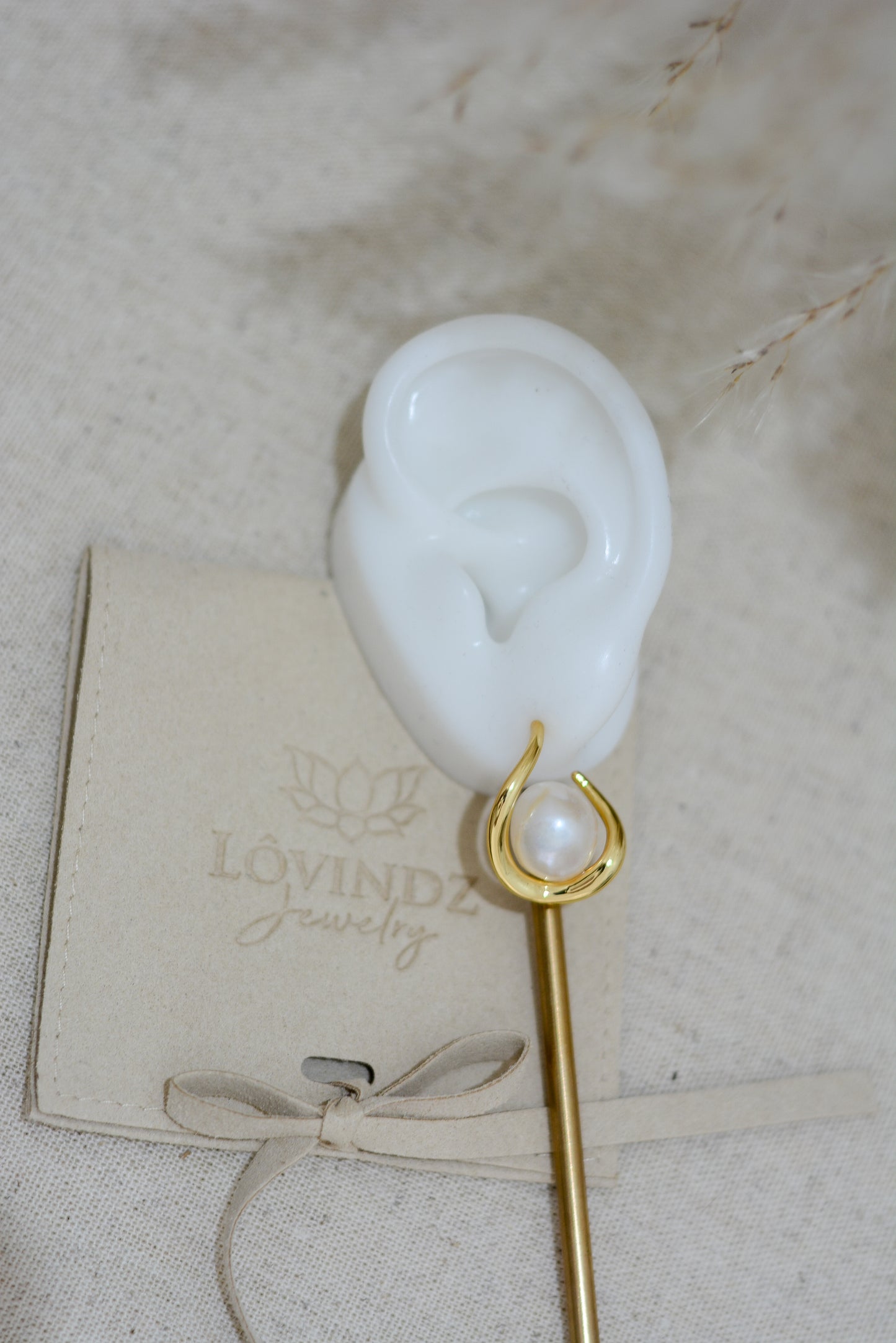 Arete geométrico con perla