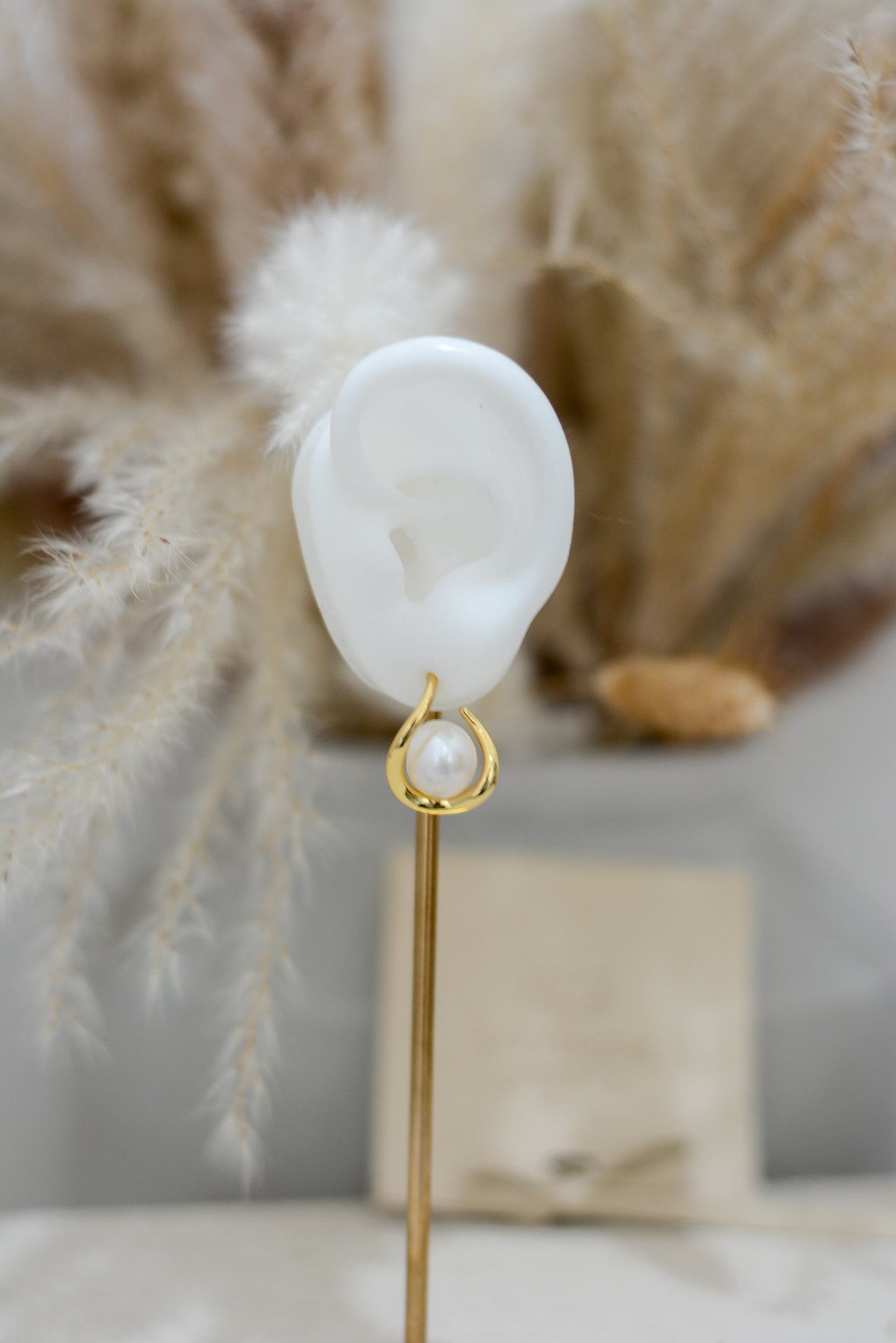Arete geométrico con perla