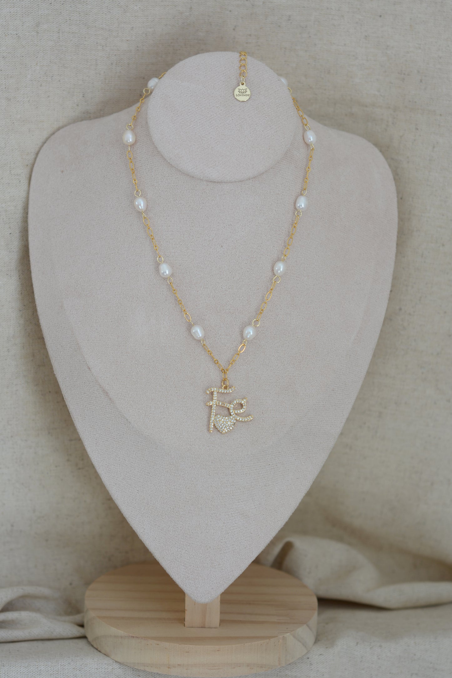 Cadena fe, perlas.