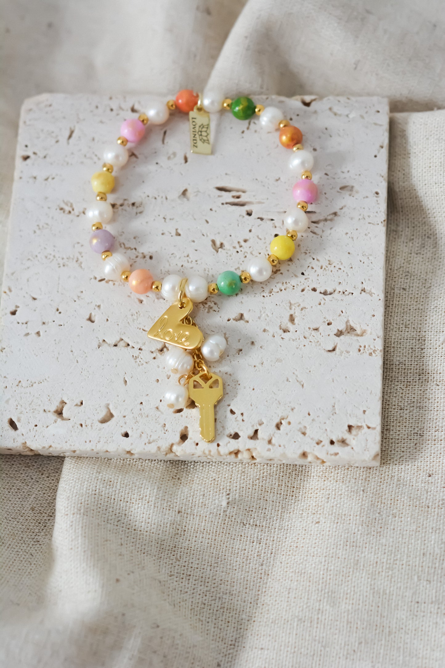 Pulsera multicolor llave